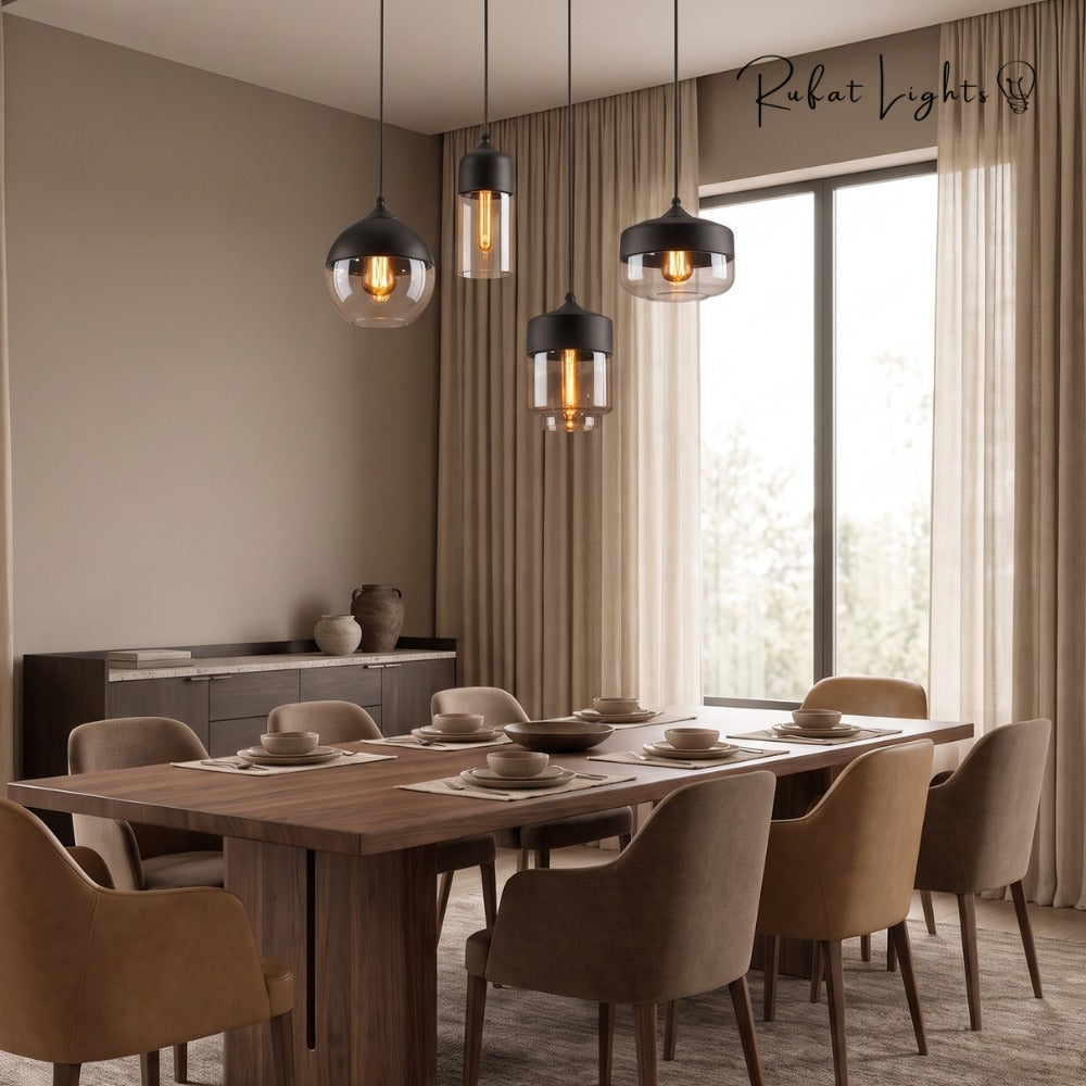 Blended Combination Metal Glass Pendant Lights in a cluster above a wooden dining table in a bright dining room