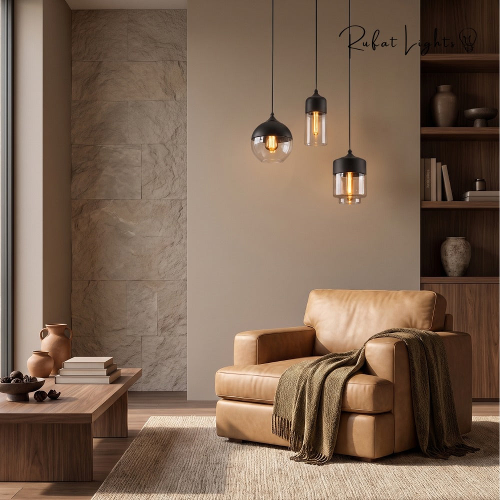 Blended Combination Metal Glass Pendant Lights cluster above a leather armchair in a living room