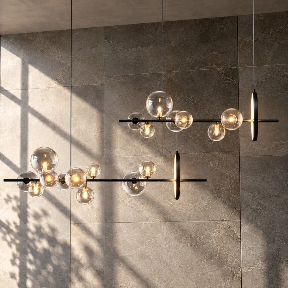 Bubble Glass Ball Metal Ring Chandelier two chandeliers against a concrete wall