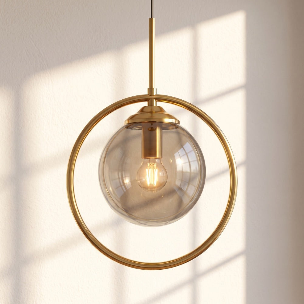 Contemporary Metal Ring Glass Pendant Lights Amber Halo with gold ring in sunlight