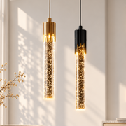 Crystal Radiance LED Bar Pendant Light black and gold crystal LED bar pendants glowing in a sunlit room