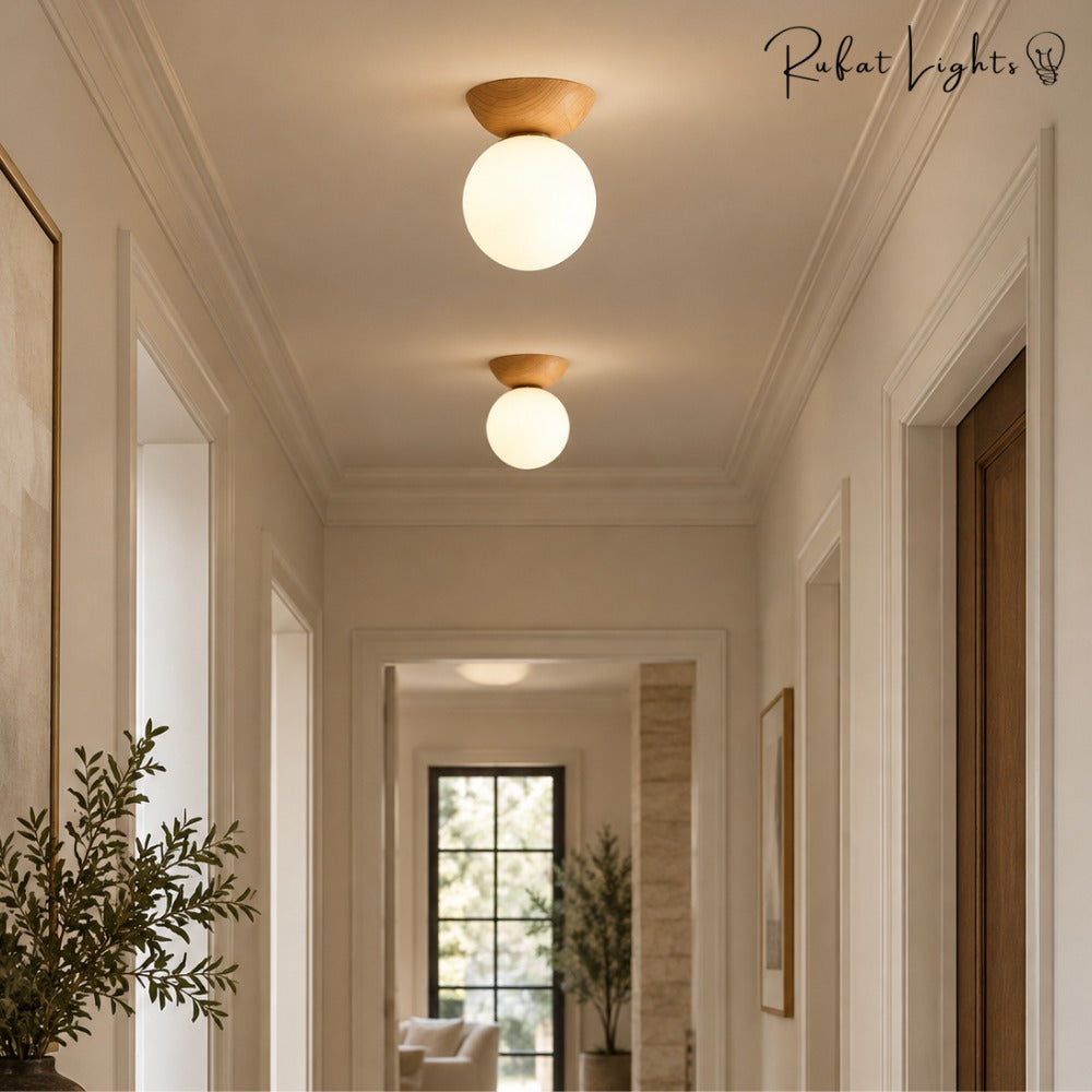 Crystal Sphere Veranda Hanging Light Fixtures ceiling lights in light wood along a bright hallway