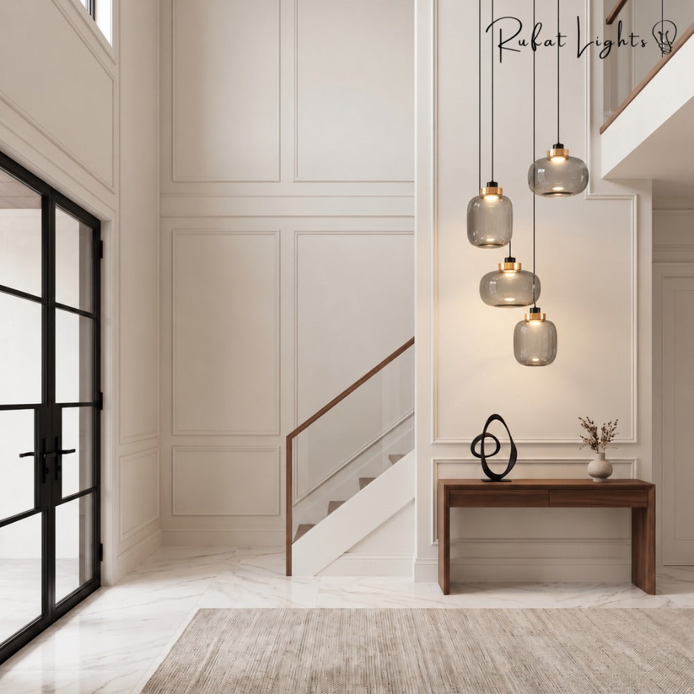 Designer Cylinder Hallow Glass Pendant Light cluster in a staircase foyer