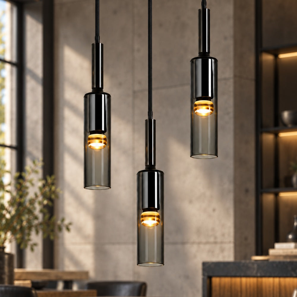 Modern Cylindrical Glass Pendant Light trio in a dark interior