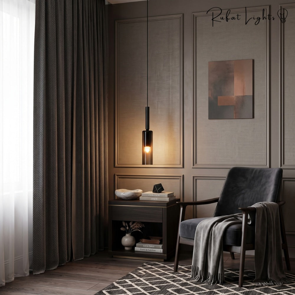 Modern Cylindrical Glass Pendant Light single beside an armchair