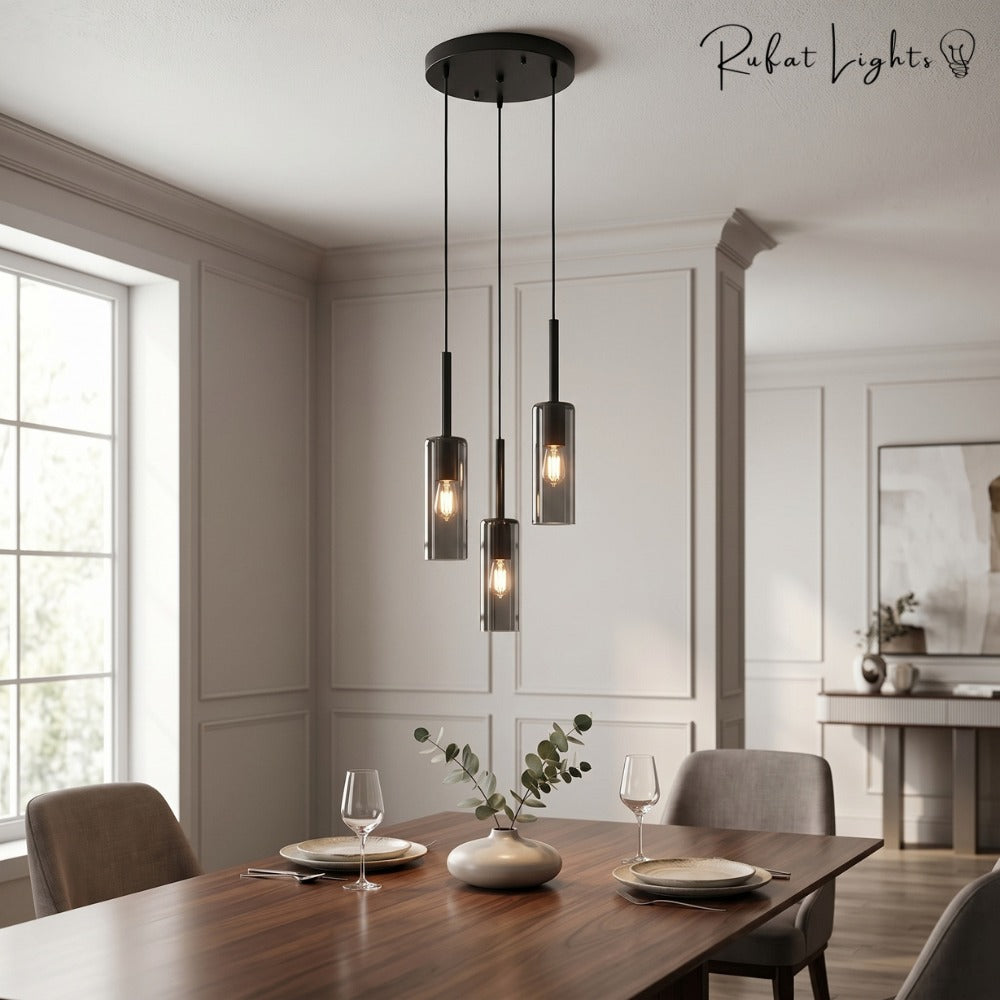 Modern Cylindrical Glass Pendant Light disk above a dining table