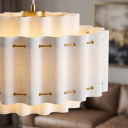 French Wabi-Sabi Light, white hand-knitted fabric wavy pendant lampshade with gold pins, lit close-up