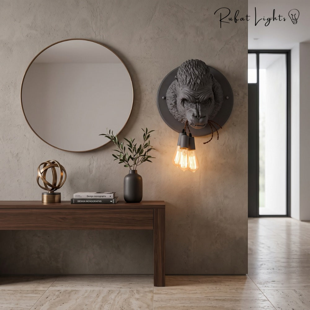 Nordic Resin King Kong Gorilla Wall Lamp in black beside a round mirror in a foyer