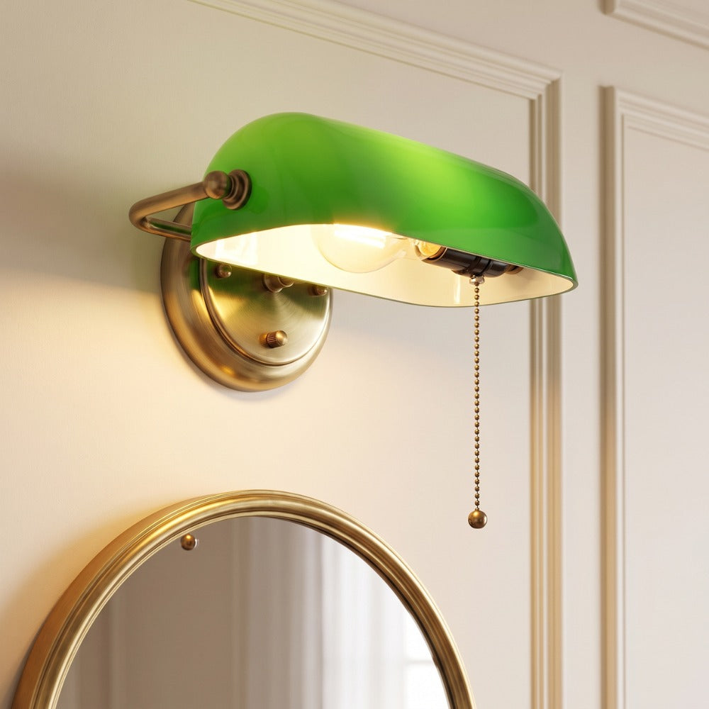 Industrial Vintage Green Banker Wall Lamp with green glass shade and brass arm above a round mirror