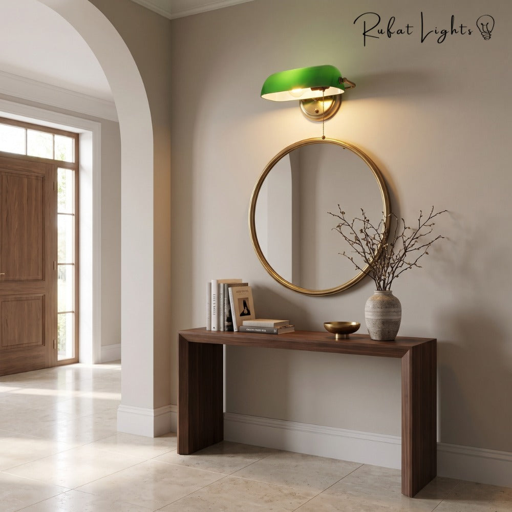 Industrial Vintage Green Banker Wall Lamp above a round mirror and console table in a foyer