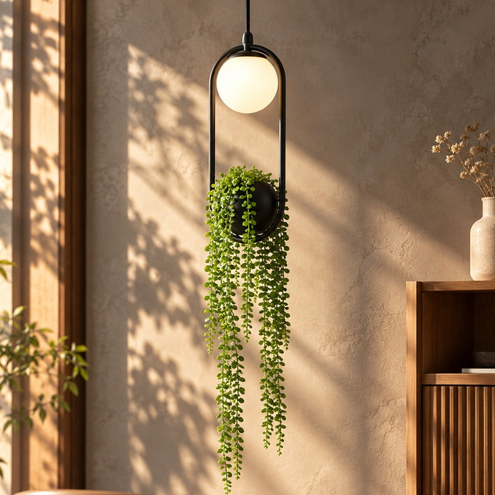 Hanging Garden LED Pendant Light With Artificial Plant against a sunlit wall