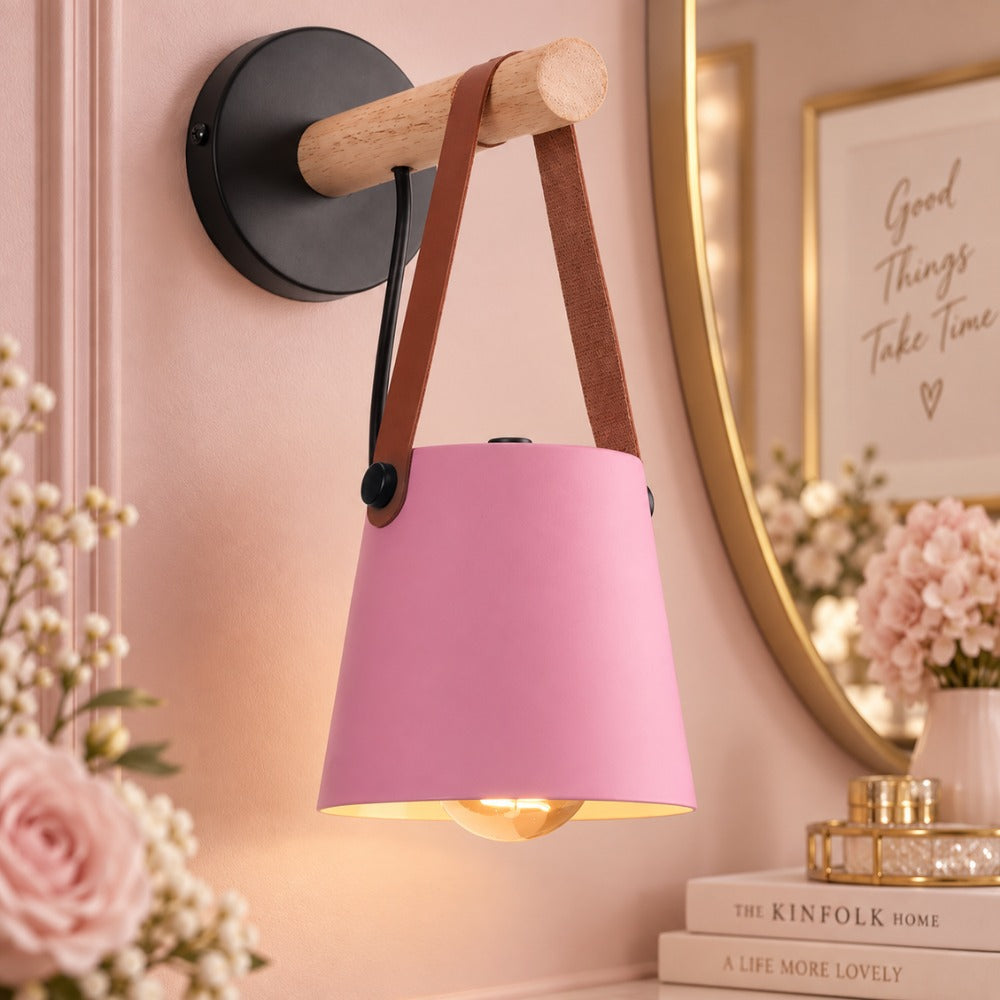Leather Strap Wood Wall Lamps pink shade beside a vanity mirror