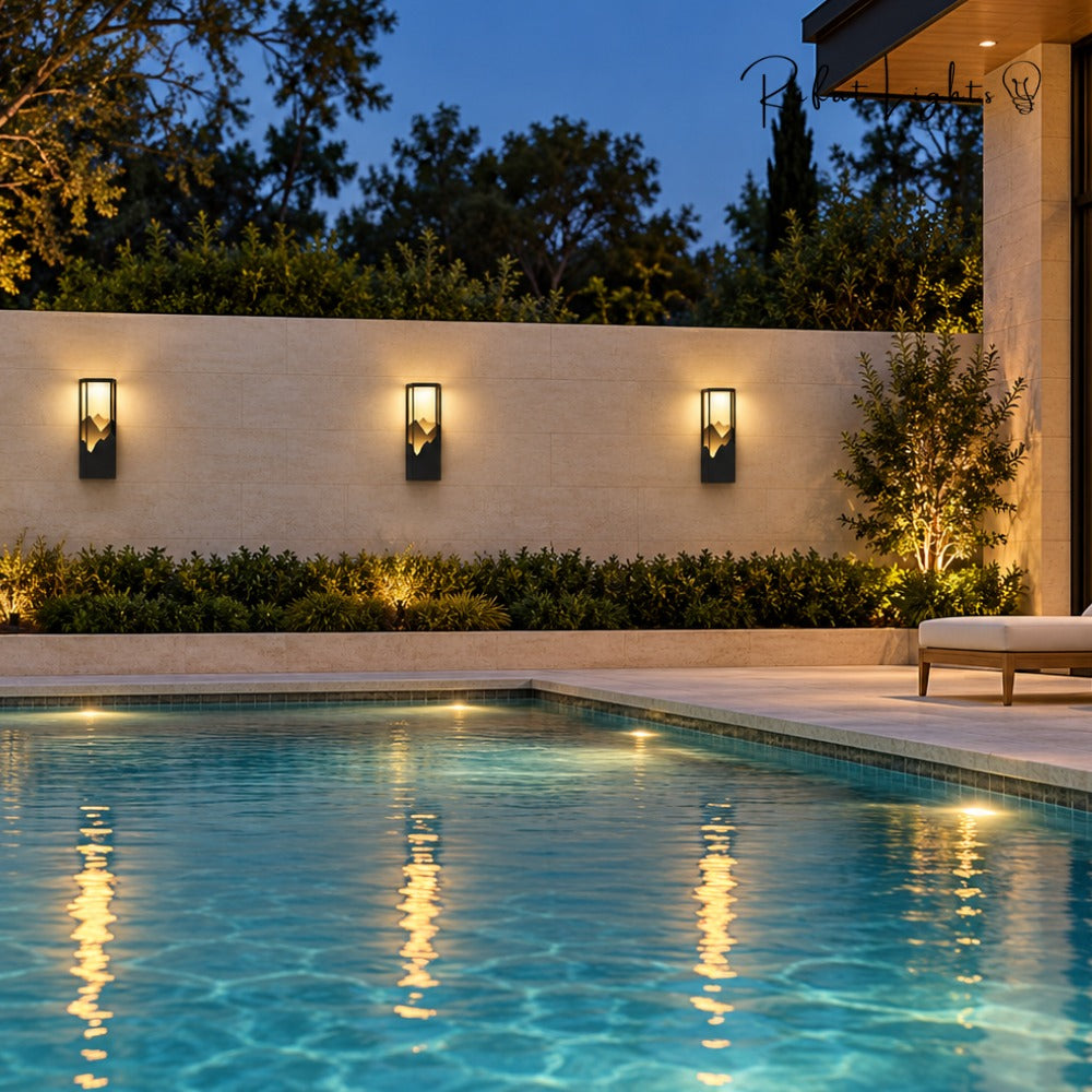 LED Outdoor Waterproof Garden Wall Lamps row along a poolside wall at night