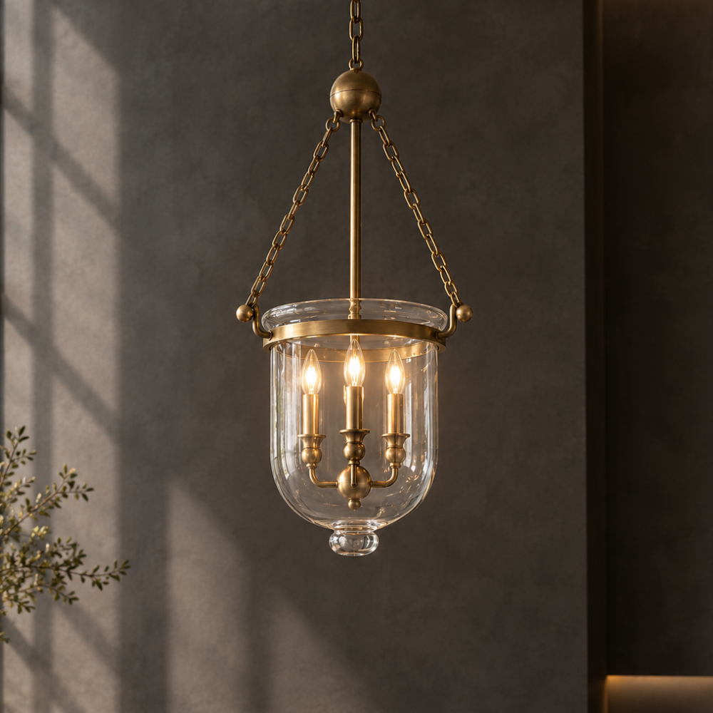 Loft Bar Candle Glass Pendant Lights brass bell jar candle pendant glowing against a dark wall