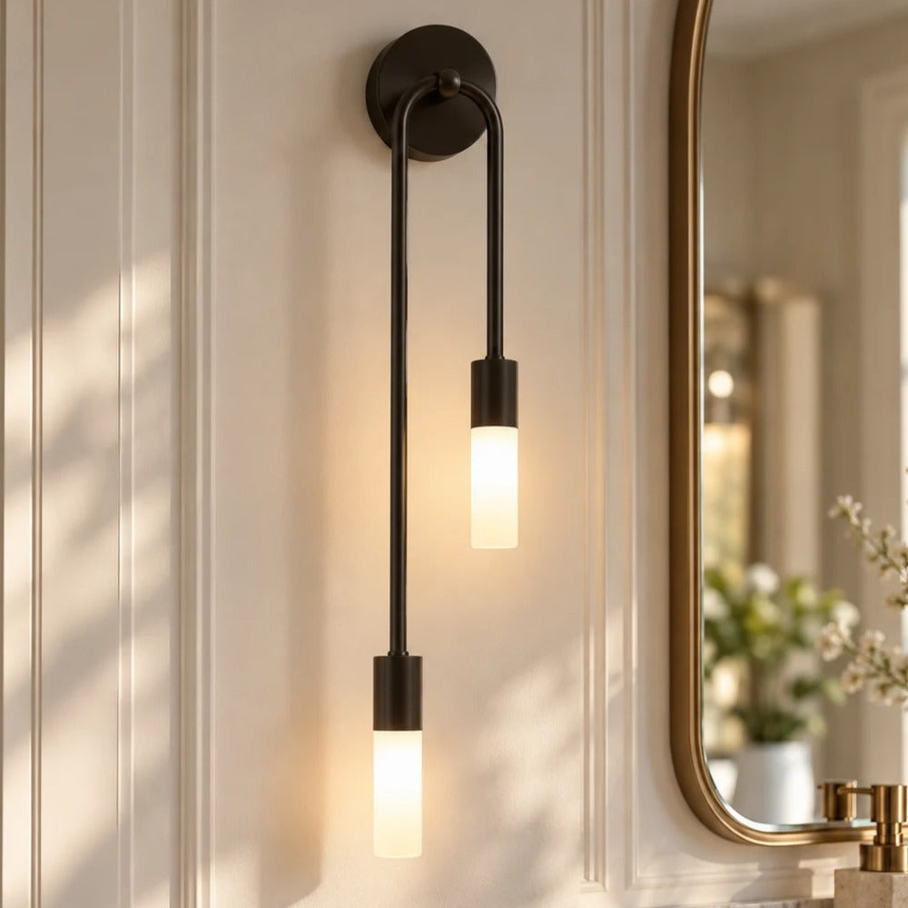 Modern Copper U-Shape Luster LED Wall Lamp Black beside a mirror