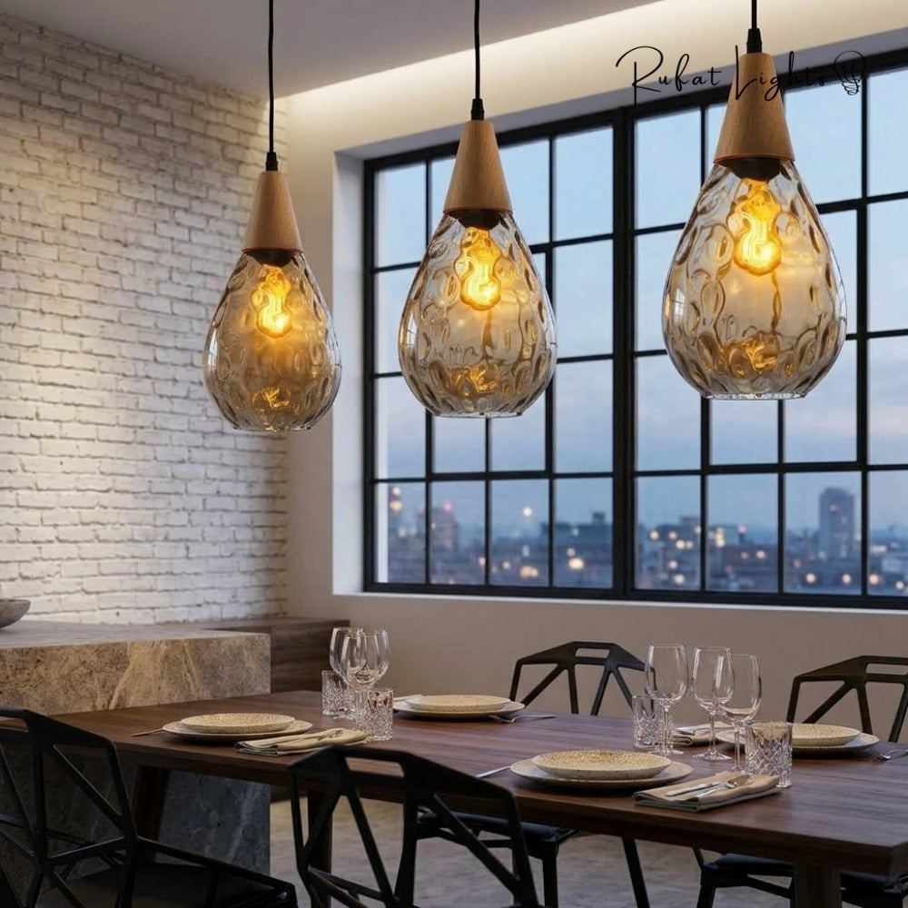 Modern Glass Water Drop Lampshade Pendant lamp trio over a dining table