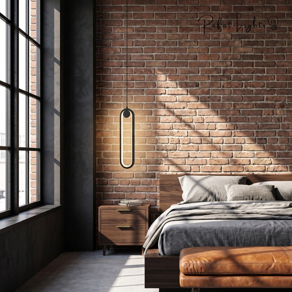 Modern LED Ovale Design Luster Fixture Pendant Lights Black beside a bed with brick wall