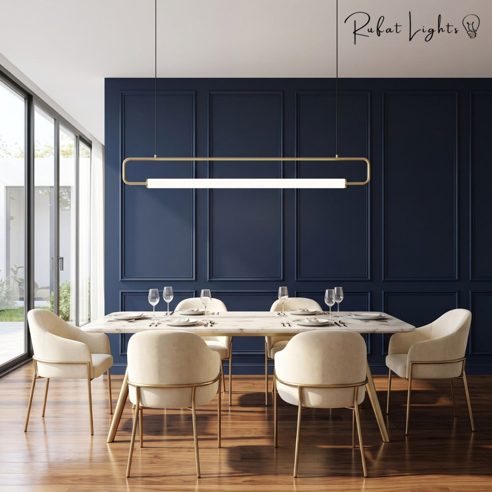 Modern LED Tube Pendant Lights Gold over a dining table with blue walls