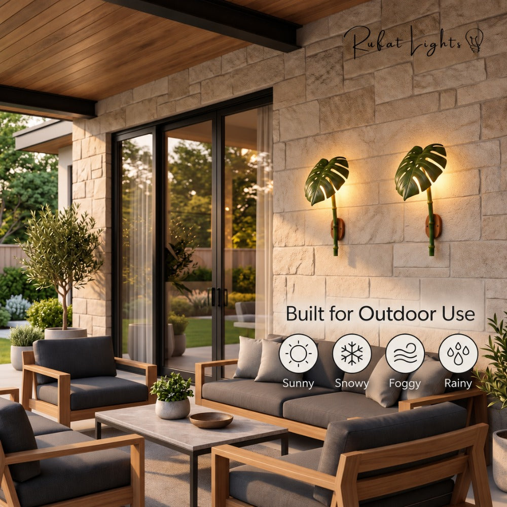 Monstera Leaf Bamboo Outdoor Wall Lamp pair on an outdoor patio