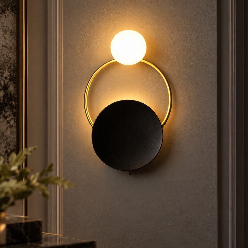 Nordic Modern Ring Golden Wall Sconce Type-B with glowing globe above a black disc and gold ring