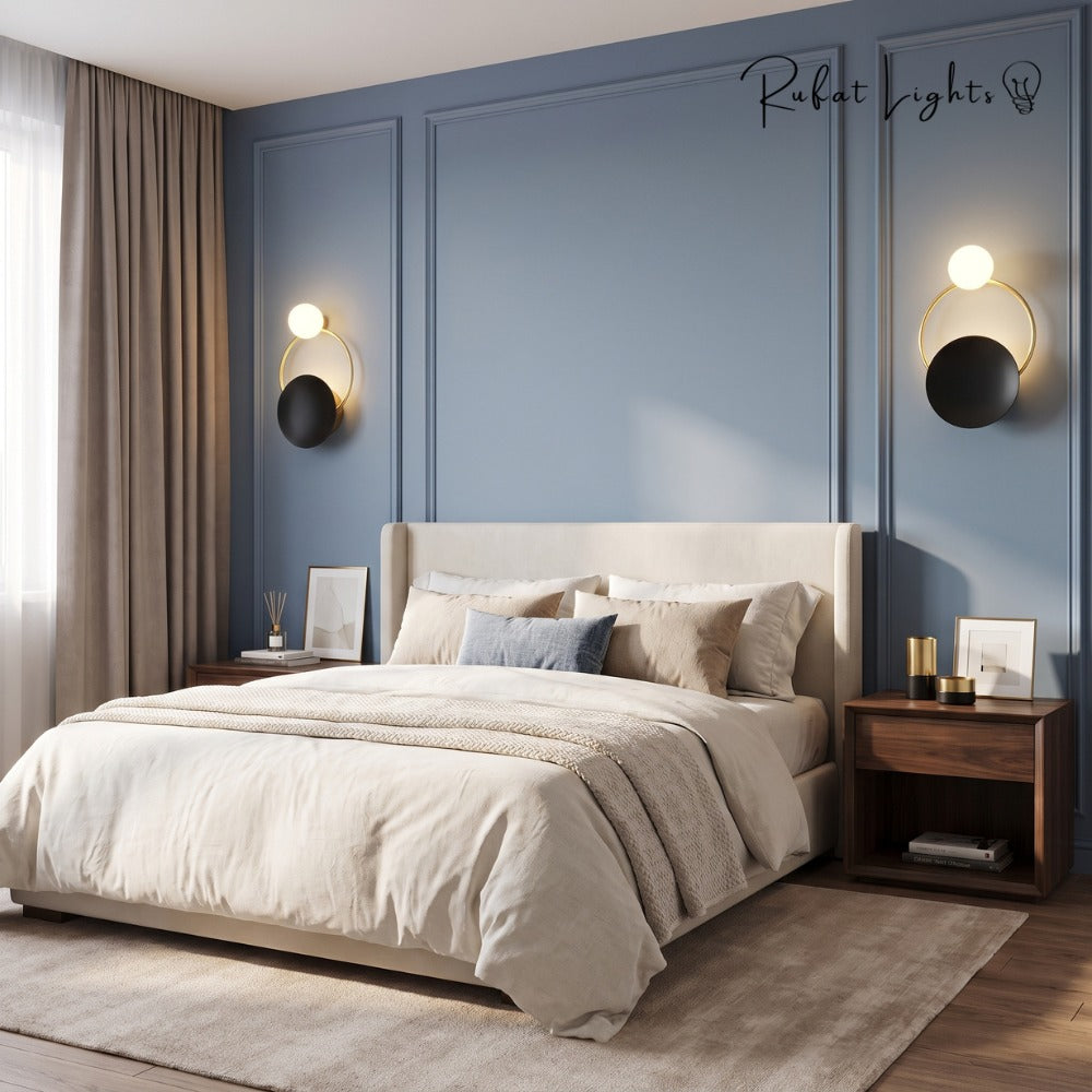 Nordic Modern Ring Golden Wall Sconce Type-B pair beside a bed in a blue-panelled bedroom
