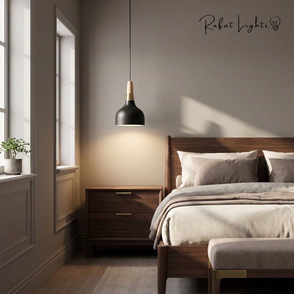 Nordic Wood Macaron Pendant Light Black beside a bed