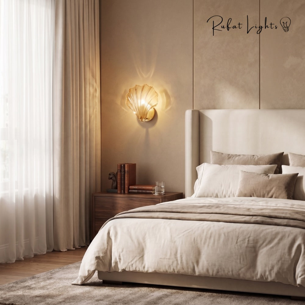 Oceanic Glass Shell Wall Light wall light above the nightstand in a cream bedroom