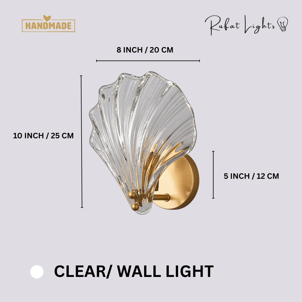 Oceanic Glass Shell Wall Light Clear Wall Light dimensions: 8 in (20 cm) wide, 10 in (25 cm) high, 5 in (12 cm) backplate