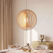 Revolving Circular Moon Wood Pendant Light over a dining table