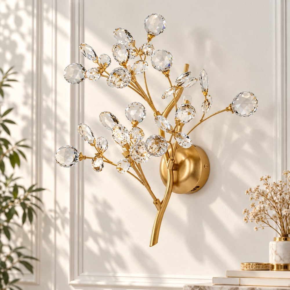 Romantic Flowers Branches Clear Crystal Wall Lamp against a white wall with leaf shadows