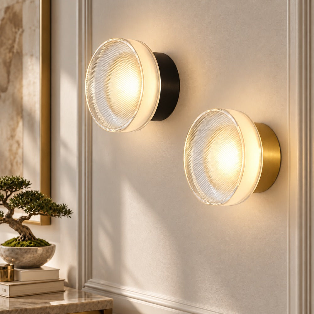 Round Textured Glass Wall Lamp pair in black and gold on a white panelled wall