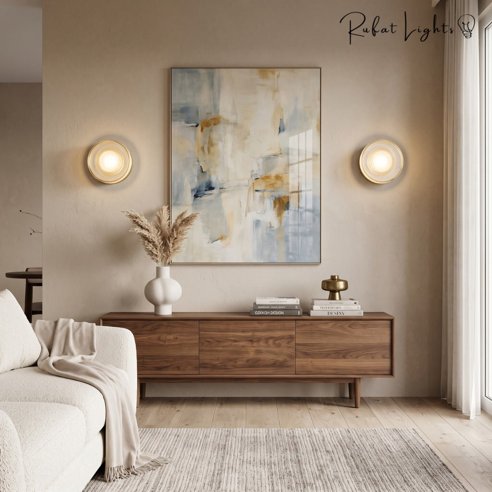 Round Textured Glass Wall Lamp in gold pair above a sideboard in a lounge
