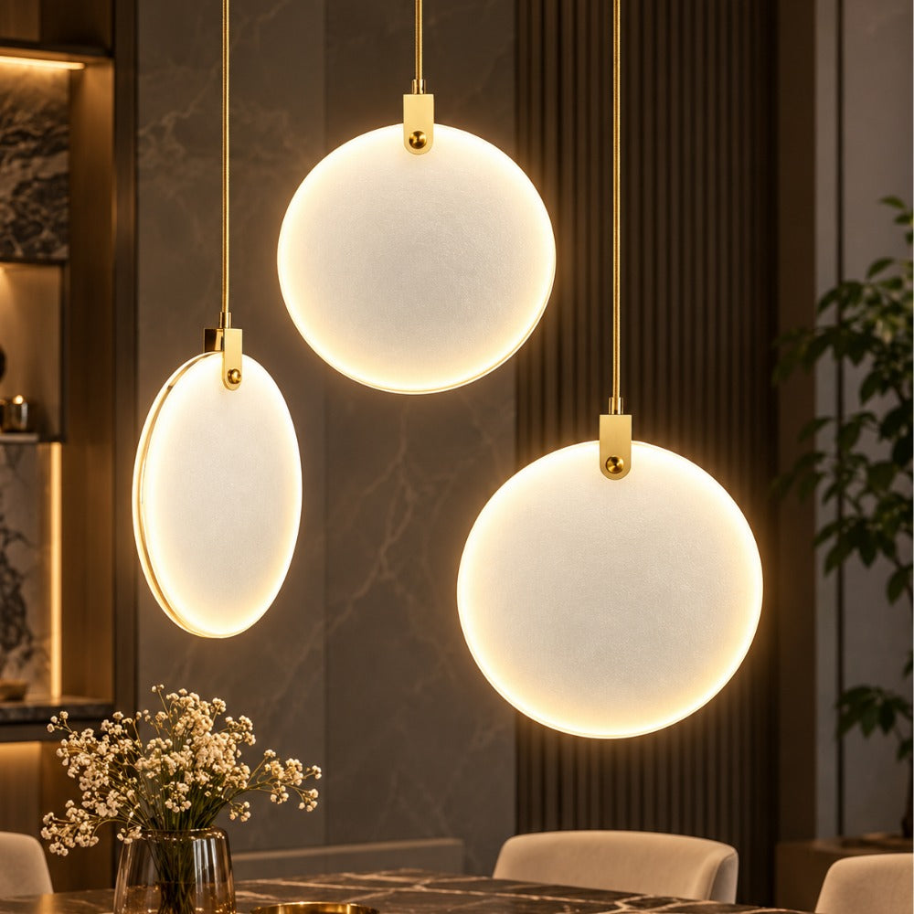 Simple Marble Round Crystal Villa Pendant Lamps trio over a dining table