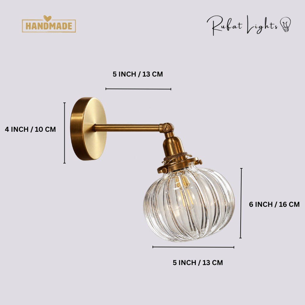 Textured Glass Globe Wall Lamp dimensions: 4 in (10 cm) canopy, 5 in (13 cm) arm, 5 in (13 cm) wide x 6 in (16 cm) high globe