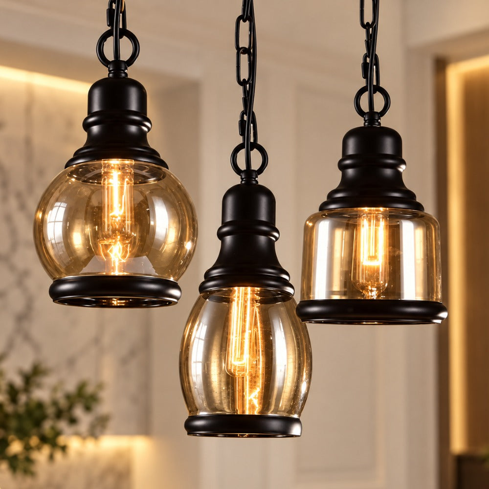 Three Vintage Loft Glass Lamp Bar Pendant Lights in black with amber glass shades and Edison bulbs on chains