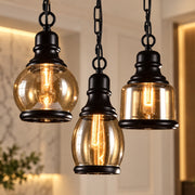 Three Vintage Loft Glass Lamp Bar Pendant Lights in black with amber glass shades and Edison bulbs on chains