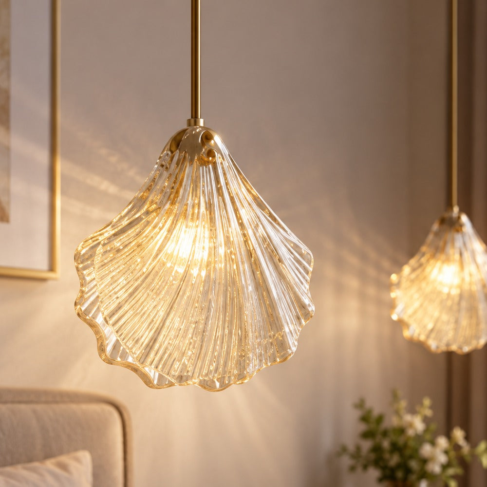 Vintage Shell Glass Pendant Light pendants in amber glass glowing in a warm living room