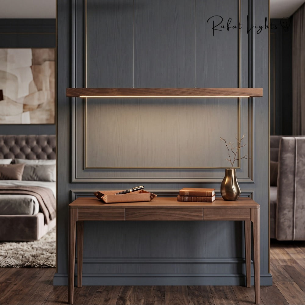 Wood Linear Sweep Sensor Chandelier black walnut above a console table
