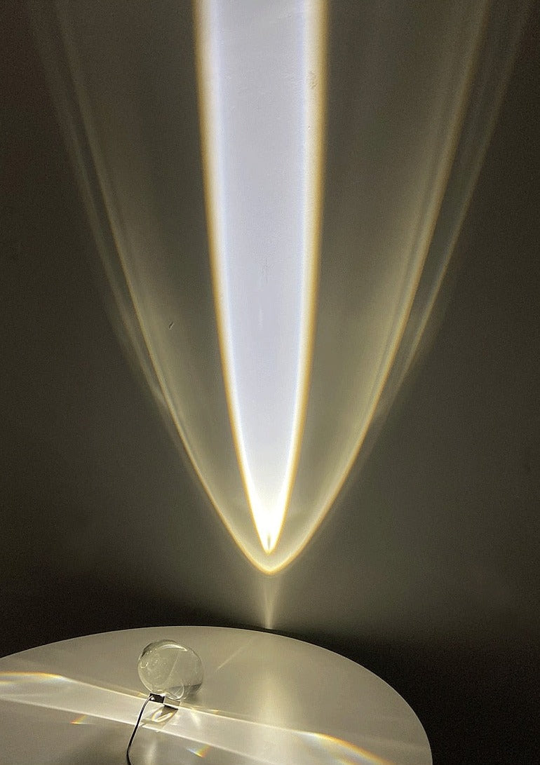 Mystical Radiance Crystal Sky Lamp in White casting a tall upward beam of white light