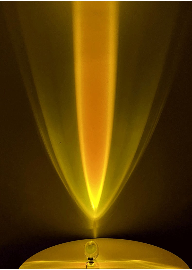 Mystical Radiance Crystal Sky Lamp in Sunset casting a tall golden yellow light beam up the wall