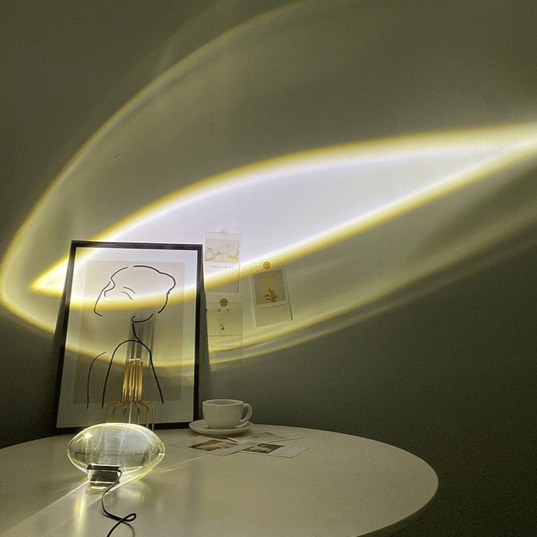 Mystical Radiance Crystal Sky Lamp on a round white table casting a white light halo onto a wall beside a framed picture