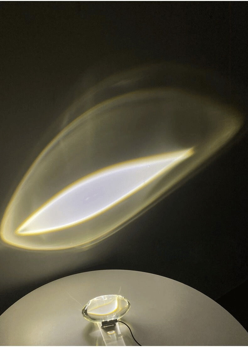 Mystical Radiance Crystal Sky Lamp in White on a table with an angled leaf-shaped light projection
